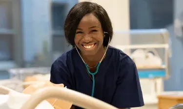 LPN Nursing Student Learning from Instructor in RN School